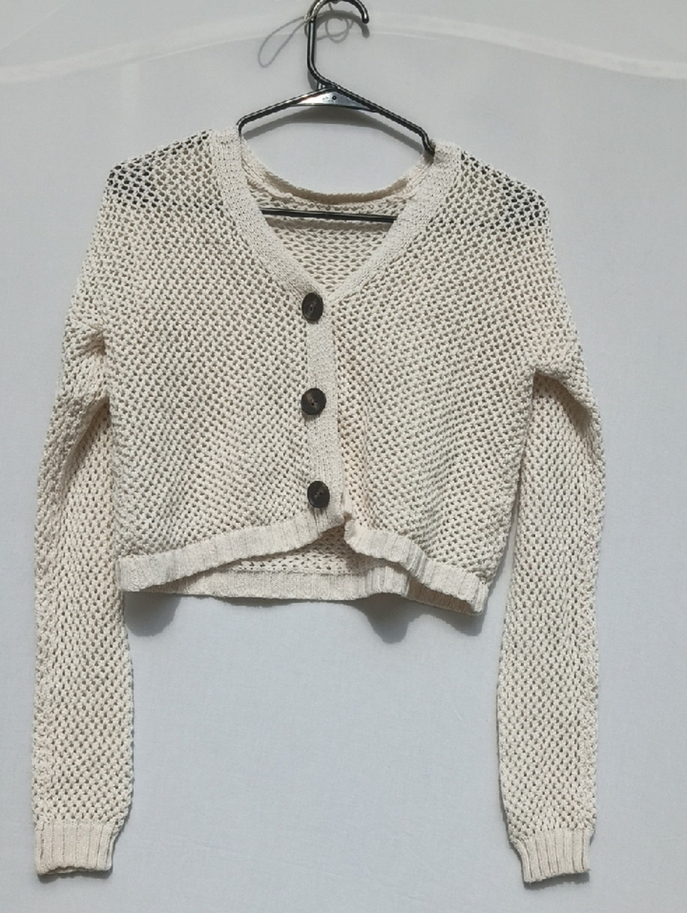 Open‑Knit Cropped V‑Neck Cardigan in Cream